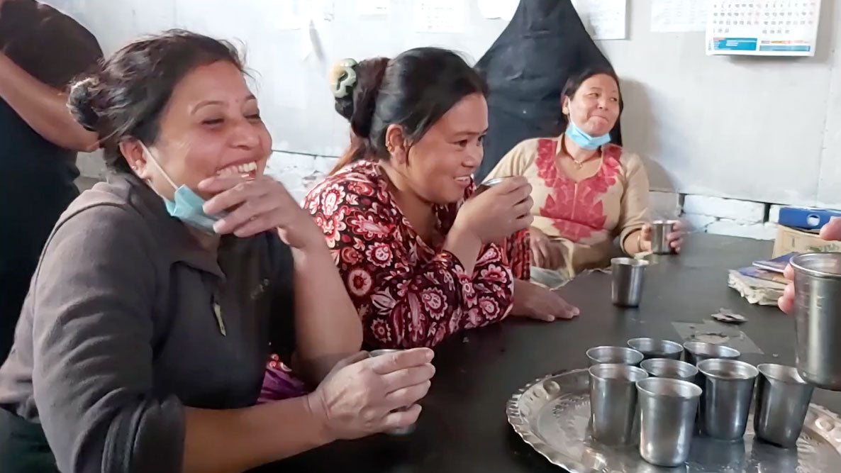 Betterfelt artisans taking a break from creating felt wool slippers