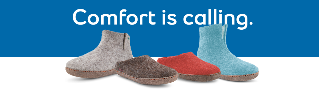 Image Of Betterfelt Slippers Sitting On A White And Blue Background