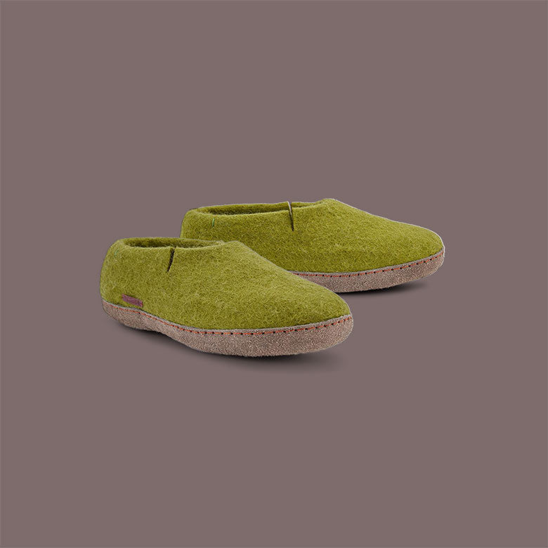 Betterfelt Classic Shoe in Green Wool Felt With Leather Soles Against a Smoke Colored Backdrop